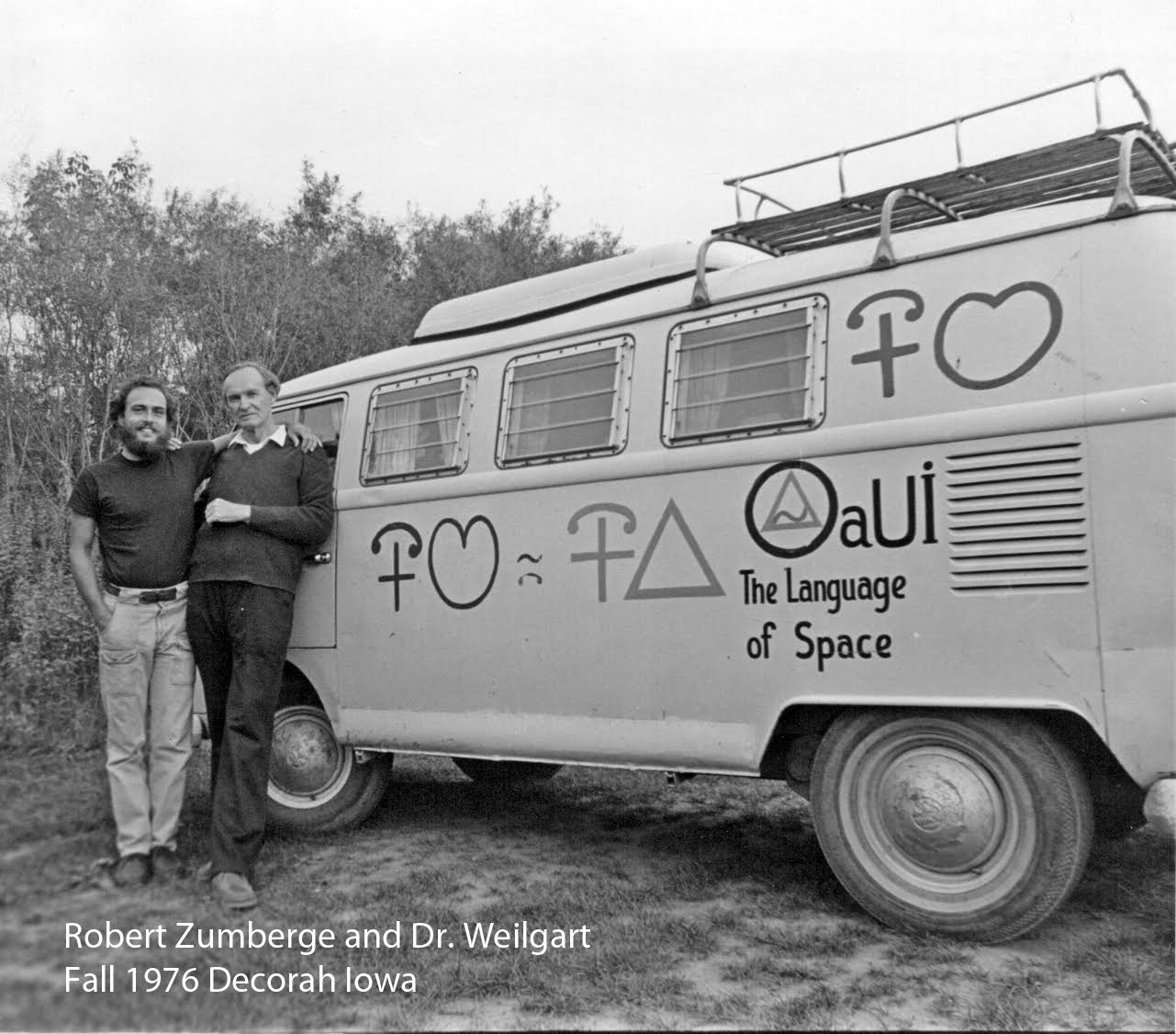 Robert Zumberge and Dr. Weilgart beside a VW bus painted with aUI symbols, Decorah Iowa, Fall 1976